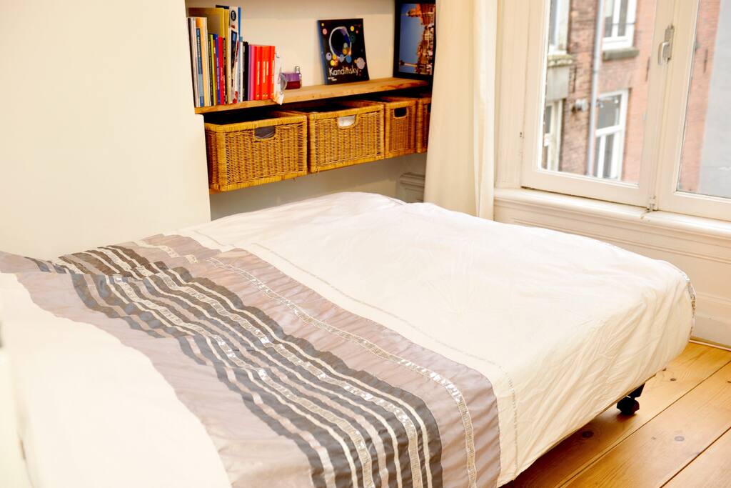 Bedroom with double seize bed at back side of the house