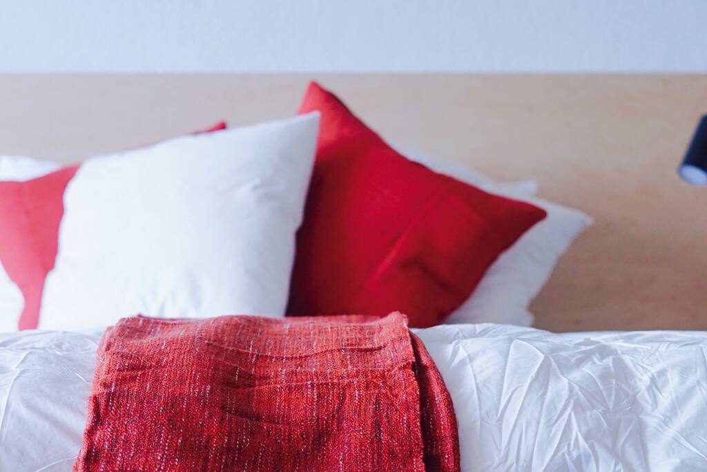 Down comforters and modern furnishings combine cozy and cool