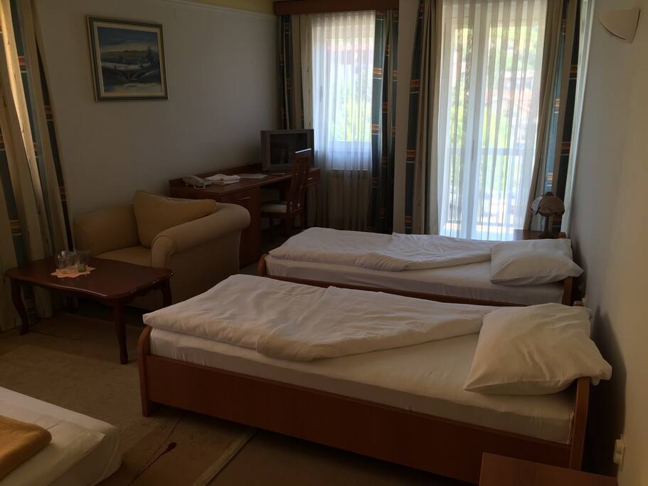 Room 1, 3 beds, 1 french bed and 2 single beds. With aircondition and balkony. Free wi-fi, tv cable, tv satellite. Max 4 people, no kitchen, but fridge is located inside the room. Very quite and silent location of an apartment, security provided all night. Noise should not be hear after 10pm. Rent a car is possible with very cheap price! Free parking, secured 24h!!!