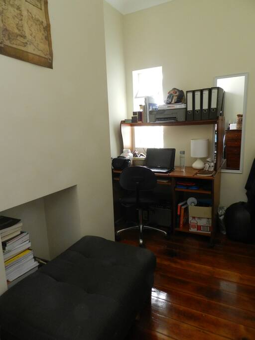 Desk and saddle stool.