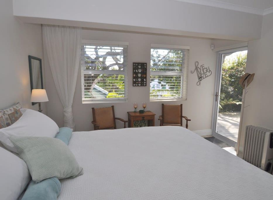 Your spacious double suite has luxurious extra length twin beds (also a luxurious extra overlay if you prefer a king), and a door onto the ground-floor deck. (Pic: Courtesy Plett Villas)