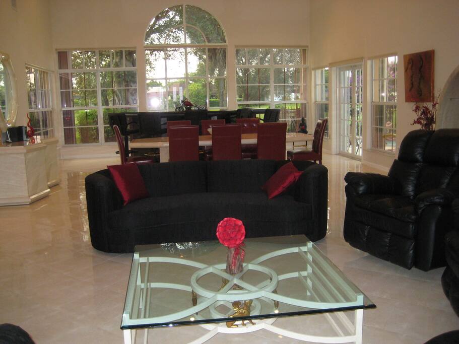 Combination living / dining room with view towards golf course