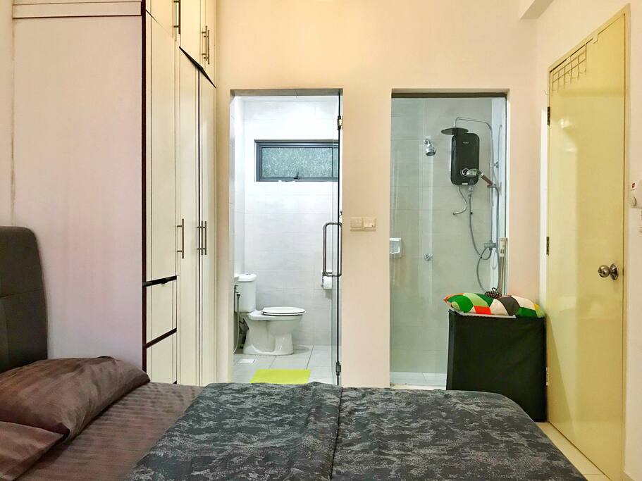 Toilet view from the bed. Build in wardrobe is on the left.