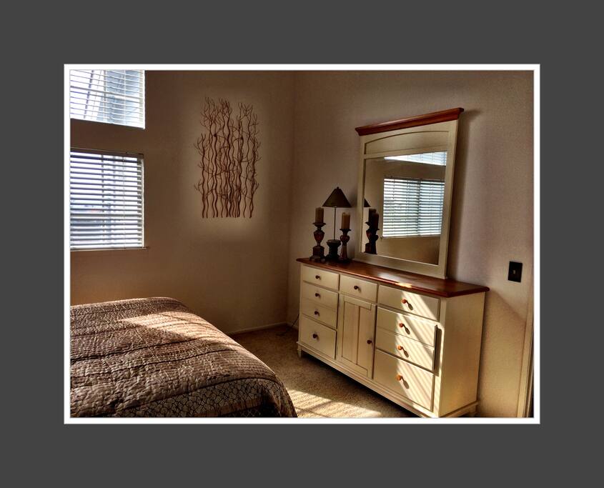 Window in bedroom overlooks ocean