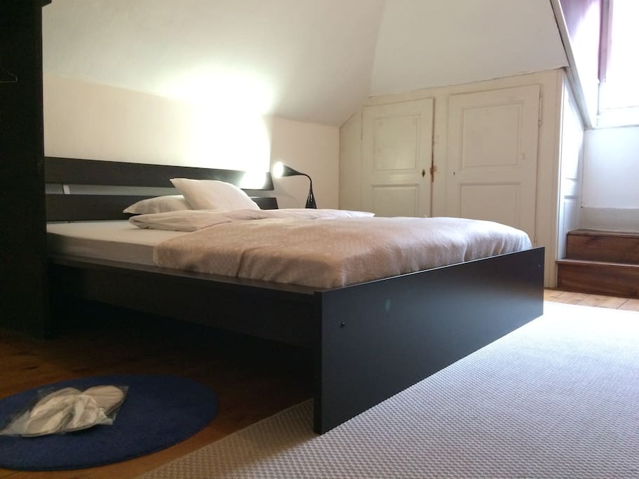 Comfortable bed, including bathroom slippers