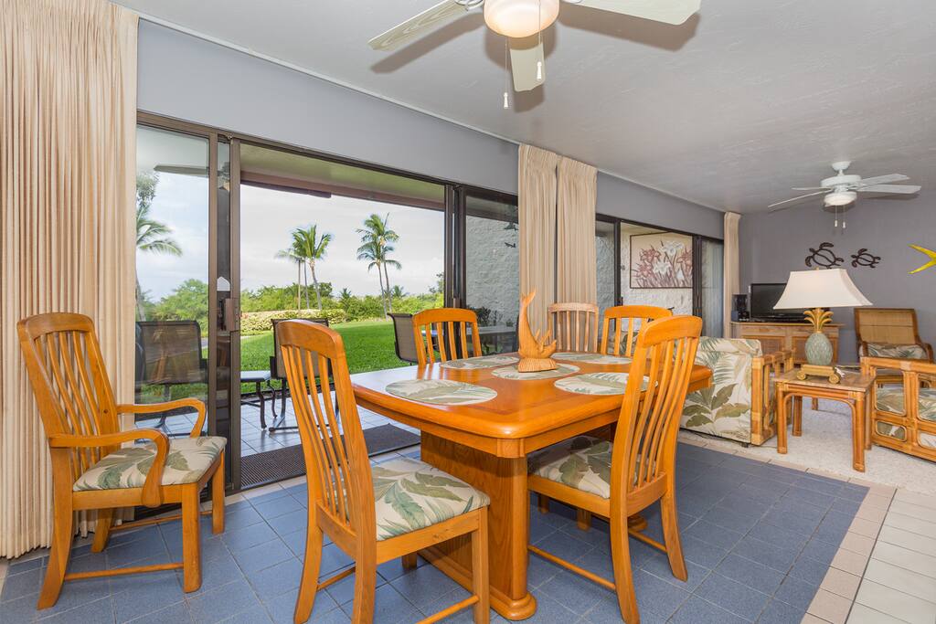 Dining area next to the living room with double sliding glass door to the lanai.