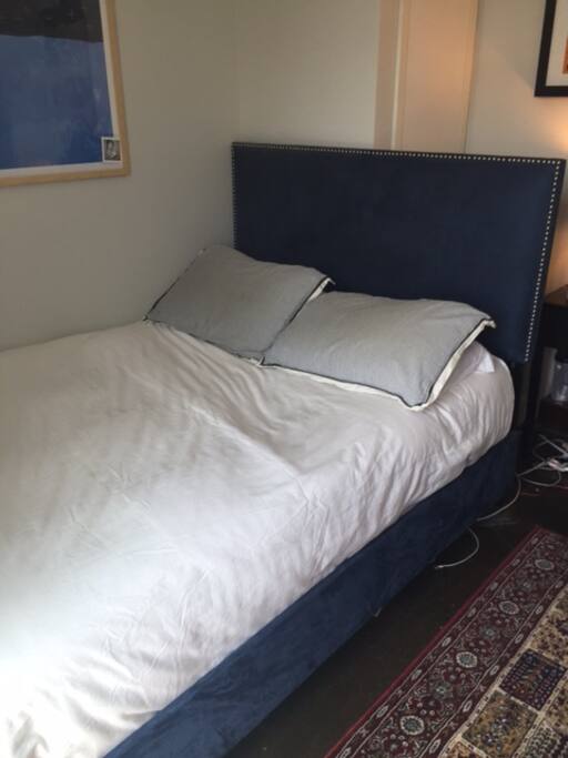 one kings bed with a fancy matress