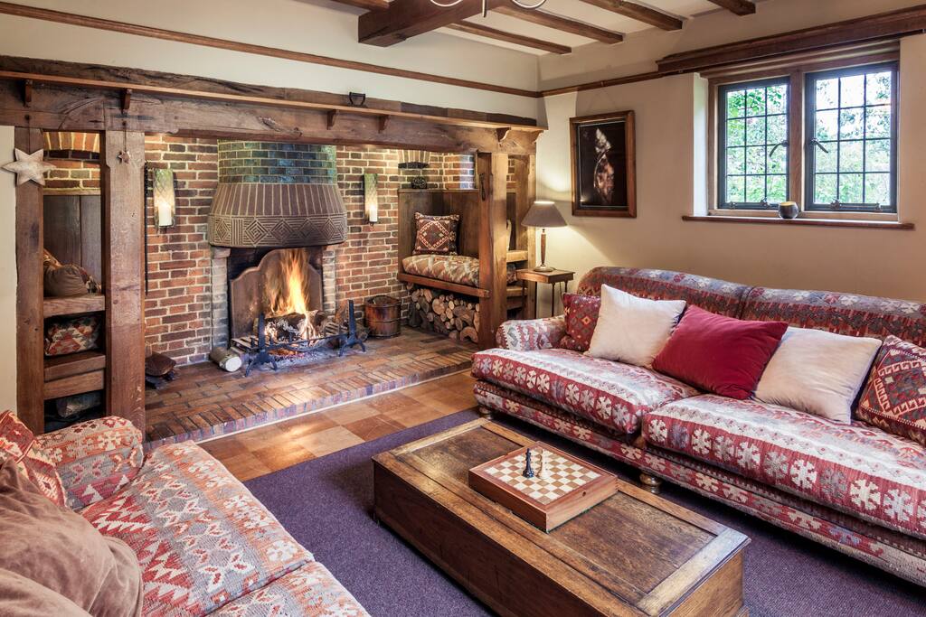 Curl up on a sofa and look out to the luscious lawn and garden