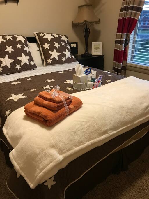 One Of the bedrooms with a Queen size bed.