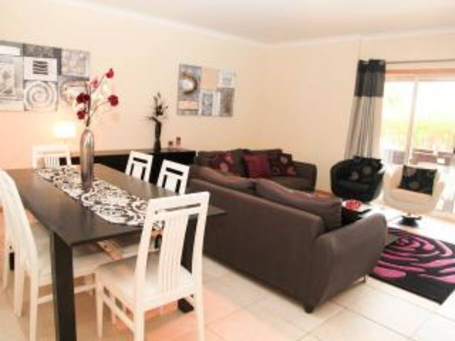 Deluxe Lounge & Dine area overlooks the gardens and swimming pool