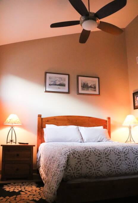 Vaulted ceiling in the loft bedroom offer comfort and gorgeous mountain views