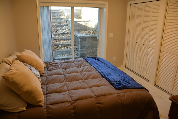 The bedroom has a private entrance and a king sized bed