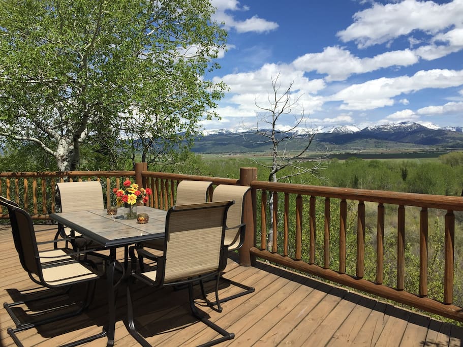 Wonderful outdoor deck area is perfect for dining, enjoying the mountain views, wildlife viewing, watching beaver in beaver pond below.
