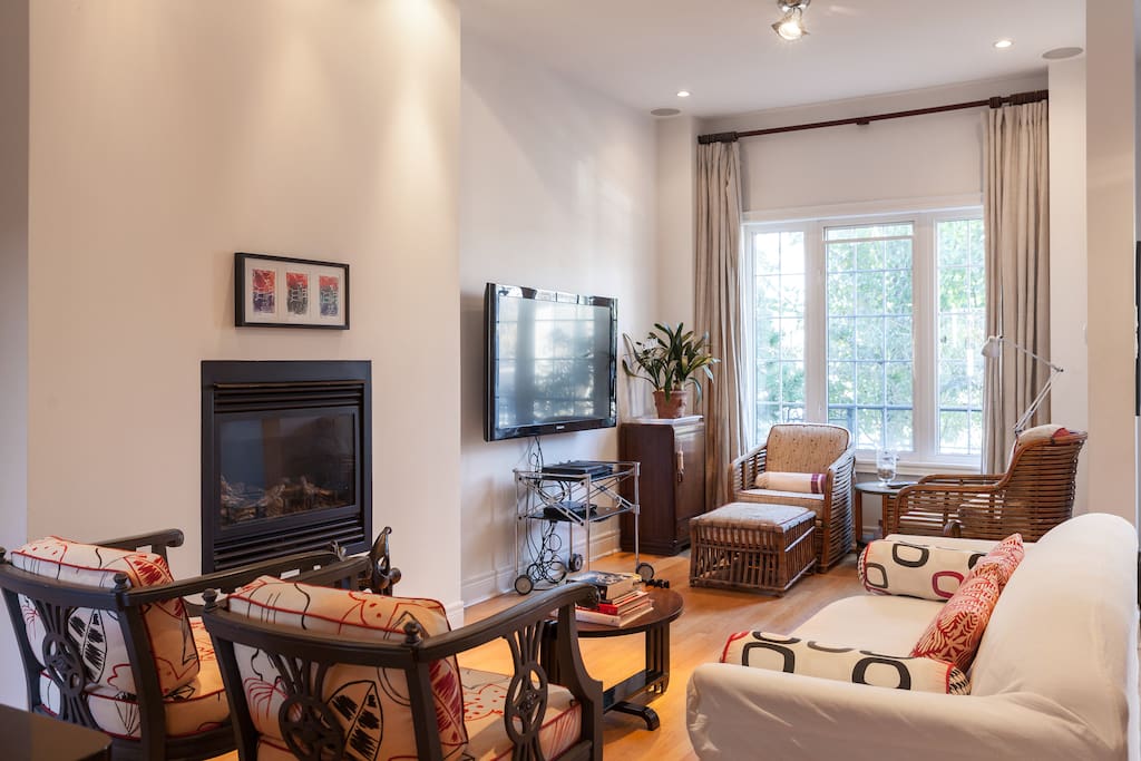 Living Room with 52" TV & wall mounted gas fireplace