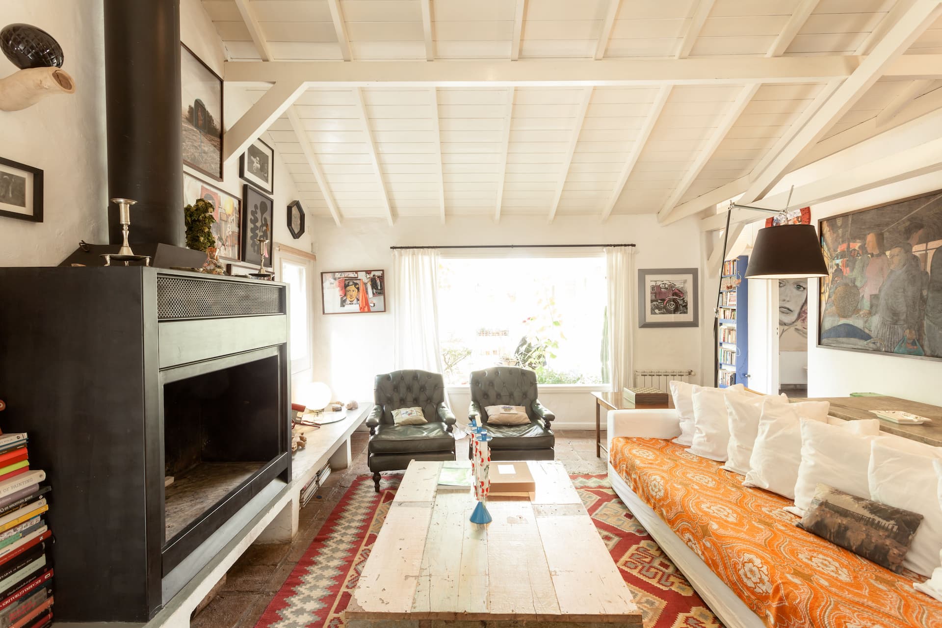 House with rose garden and art collection