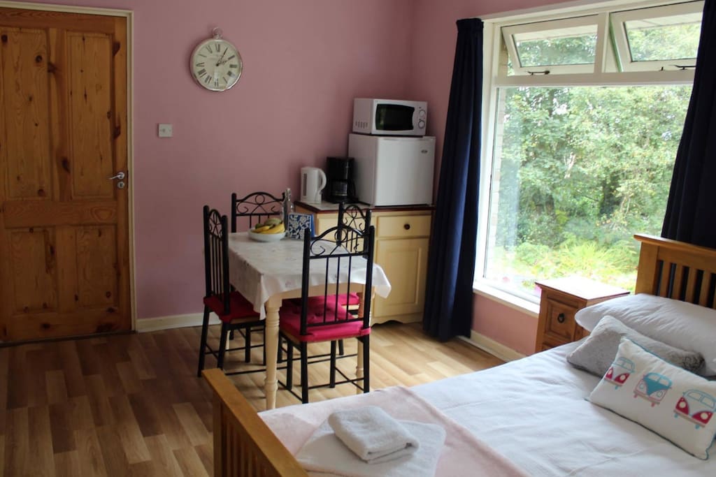 Eating area with fridge and microwave. Guests may bring in their own food.