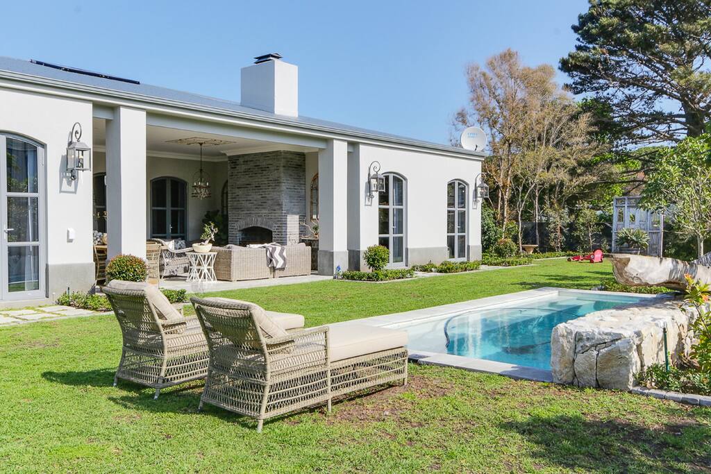 swimming pool with sun loungers
