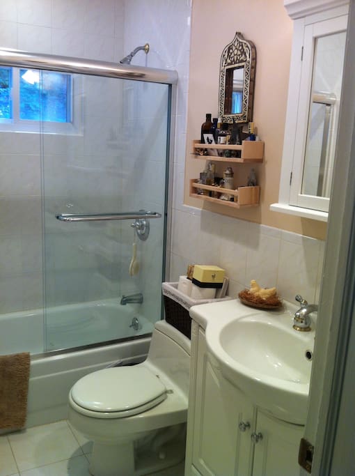 Your bright and clean bathroom - just outside your room