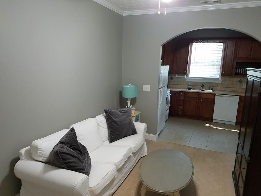 Living room with connected kitchen.