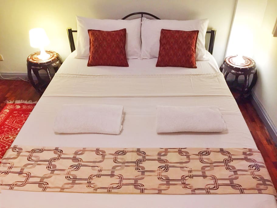 Private bedroom with queen-size bed.