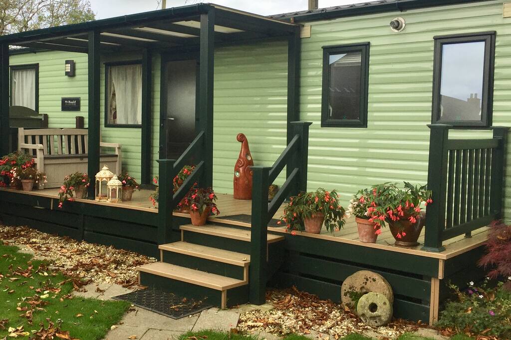 Stairs to main entrance. Decking area in large private garden.