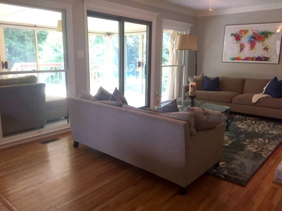 Main living area opens into the three-season sunroom. Plenty of natural light!