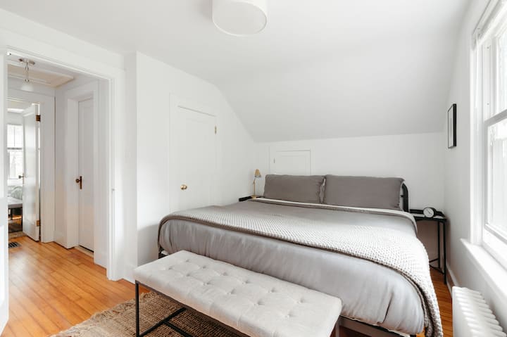 Master bedroom with King Size bed for extra comfort, new mattress, 100% organic cotton bedsheets, window treatments. All bedrooms feature it's own desk/chair to facilitate WFH. Located on second floor.
