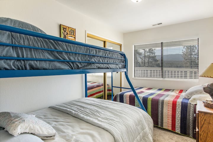 Upstairs bedroom with 2 double beds and 1 twin.