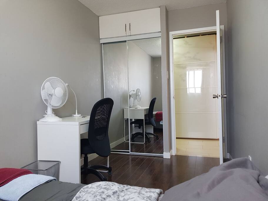 Bedroom with desk and closet