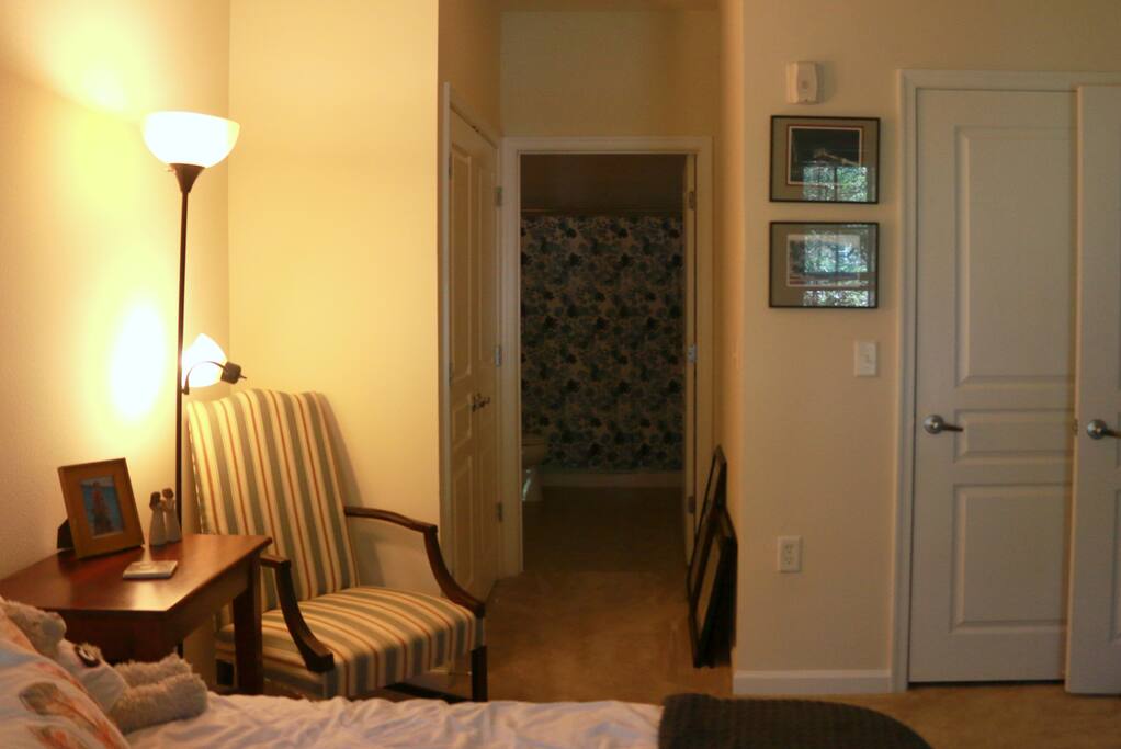 Looking across the room into the bathroom