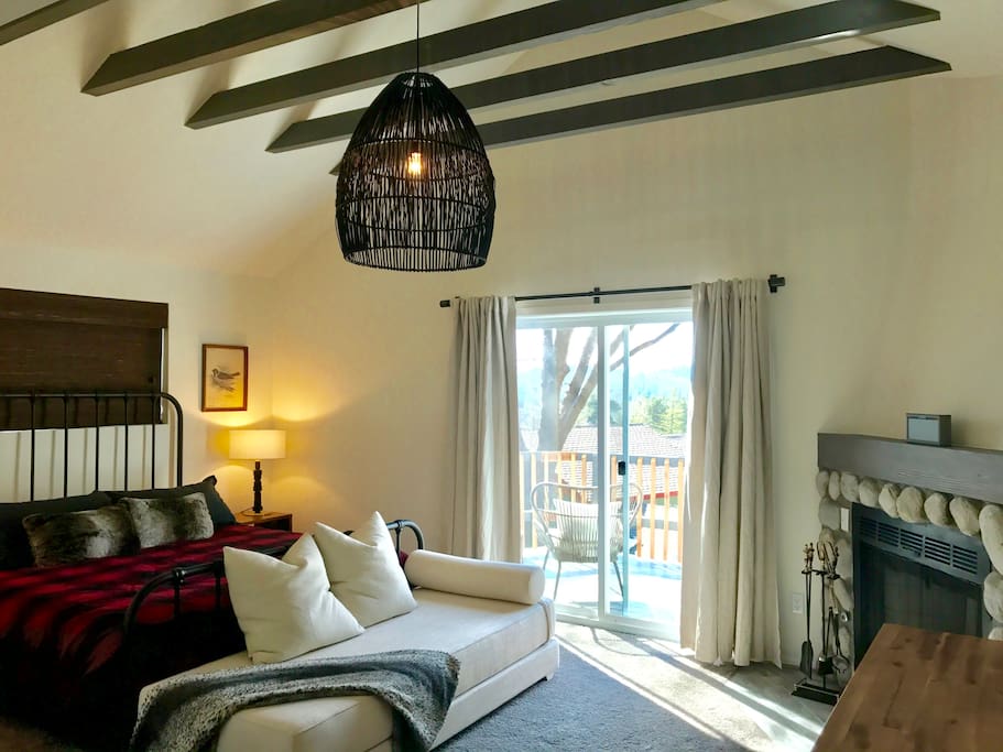 Master bedroom with on suite bathroom, fireplace and patio