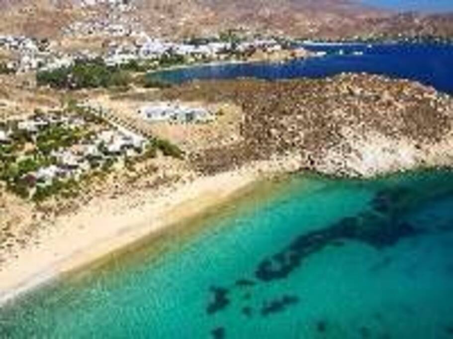 View from the sky, white house on the beach, left side front row