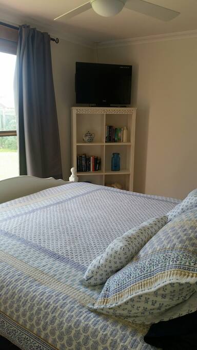 Queen Bedroom with external doors opening onto lovely decked area.