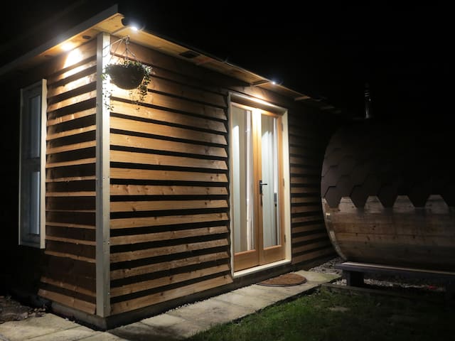 Garden holiday cabin with use of barrel sauna