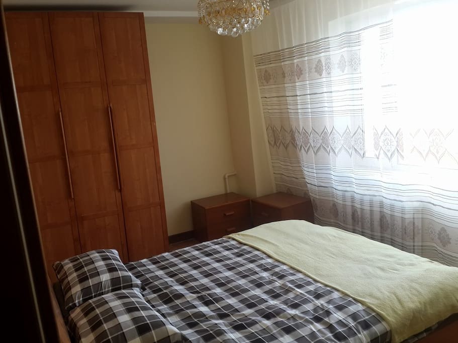 Bed room. including big size bed, wardrobe, carpet and balcony.