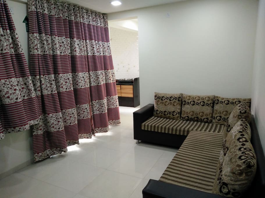 Living Room with designer sofas and curtains