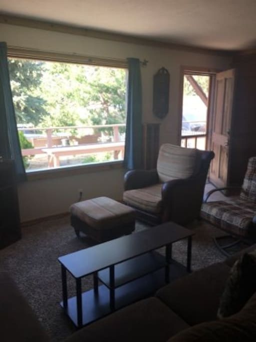 Relax in the living room as you look out the picture perfect window