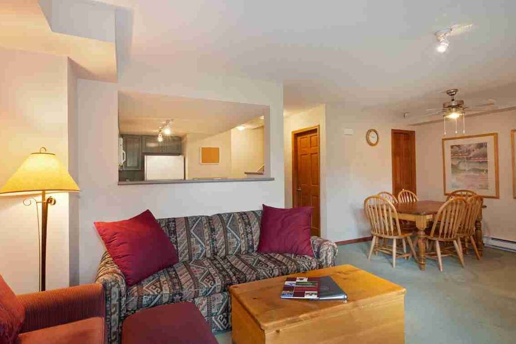 Clean and spacious living area with a dining table