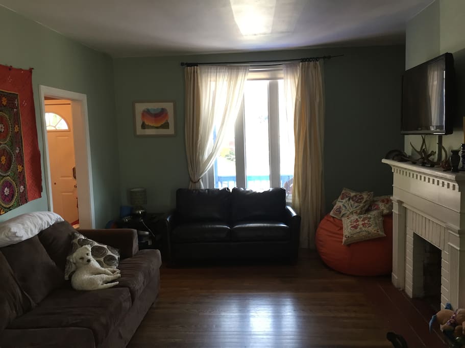 living room. Master bedroom has its own bathroom and tv.
