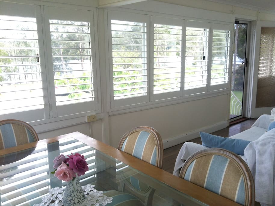 The dining table looks out onto the river - spectacular sunsets