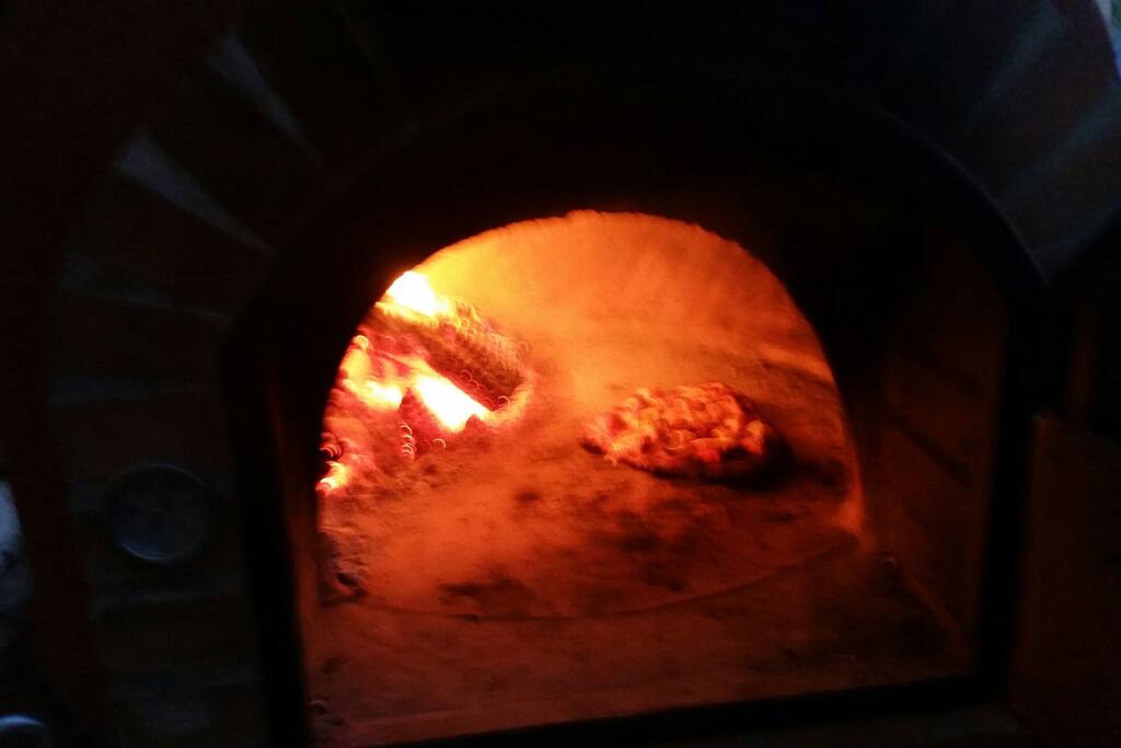 Pizza oven hot and cooking!