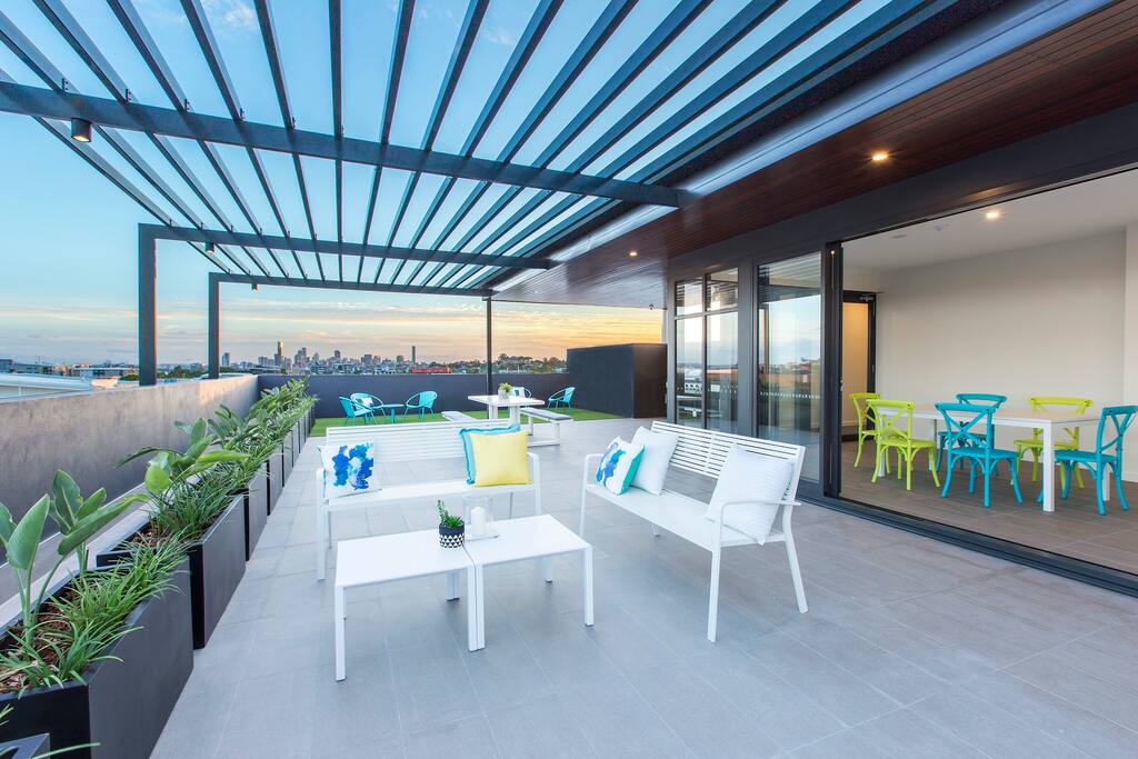 rooftop common area with a city view, perfect place to chill