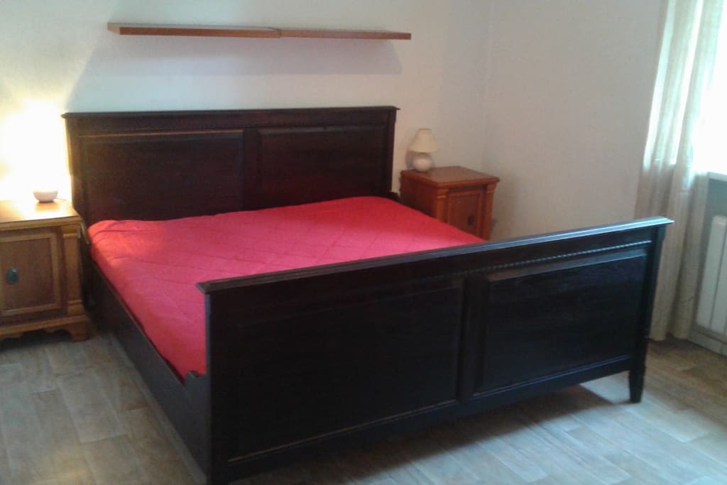 Bedroom No.1 with a built in wardrobe and racks for clothes. There is an iron and an ironing board available in the apartment. Washing machine is located in the kichen.