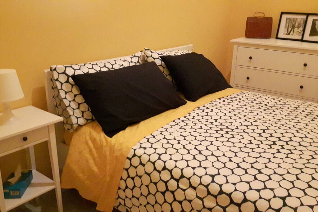 Main floor bedroom with Queen bed and dresser