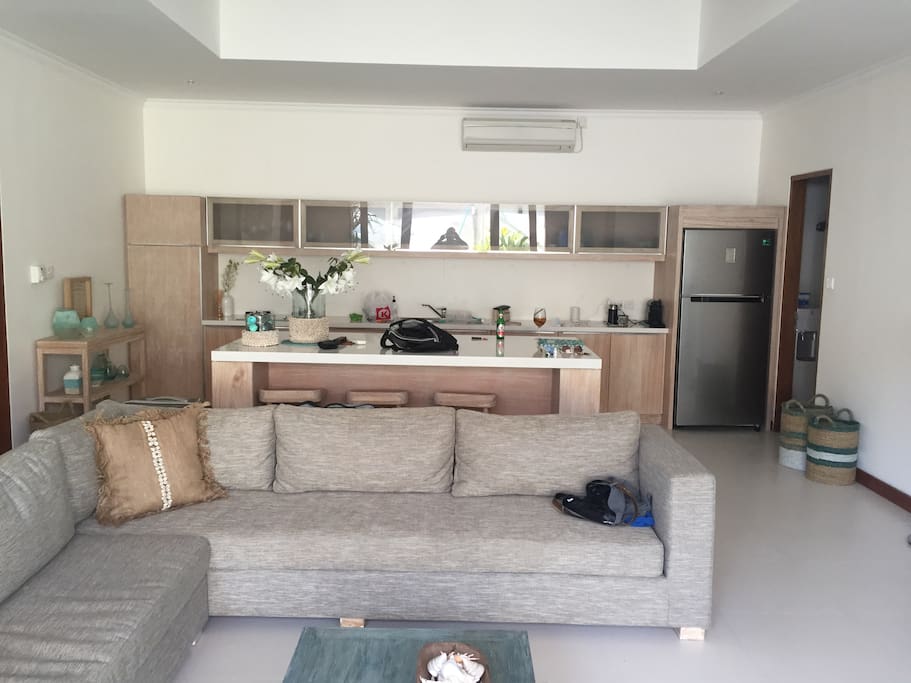 Family room with kitchen in background