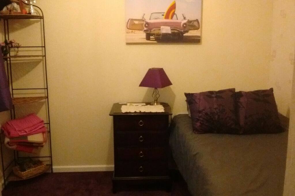Room 1 showing with 1 single bed. Sorry, taken in artificial light. Another bed can be pulled out and put on the left side of the bedside table, so two people can be accommodated.