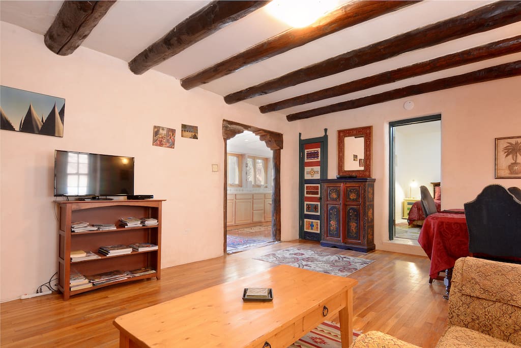 The living room, looking into the bedroom and kitchen.