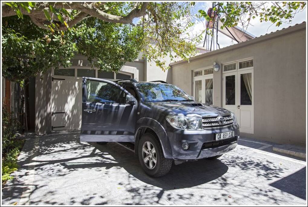 Parking space and french windows of room.