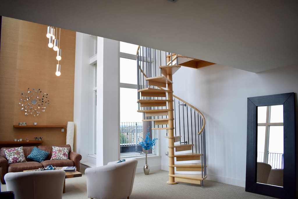 Living area and stairs up to mezzanine