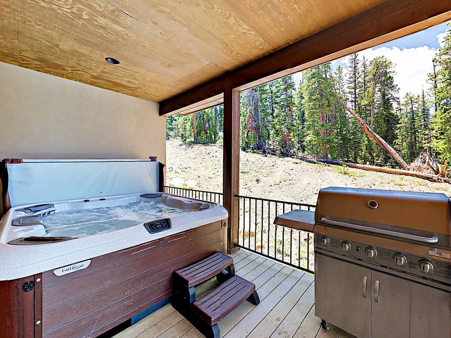 A gas grill and hot tub await on your private deck